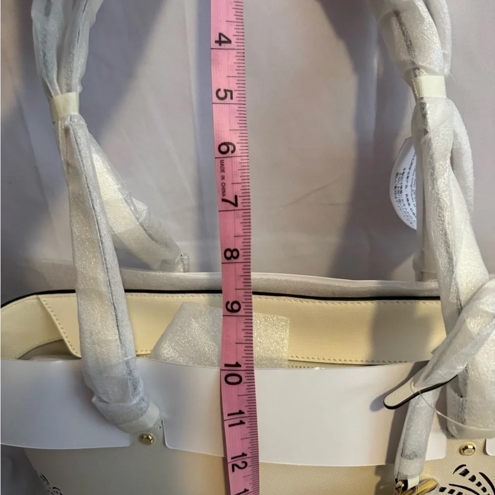 kate spade Cream Tote with Decorative Cutouts and Scarf Accent